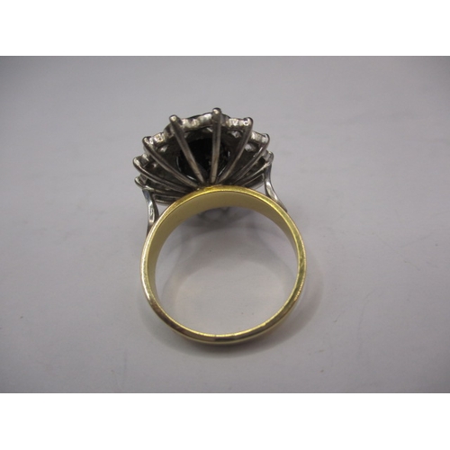 39 - A 750 yellow and white gold, diamond and sapphire ring, the central stone measuring approx. 11.1x8.8... 