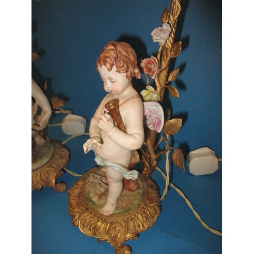 2 - Two vintage Italian porcelain cherub lamps, one with damage to fingers, the other loose to base, app... 