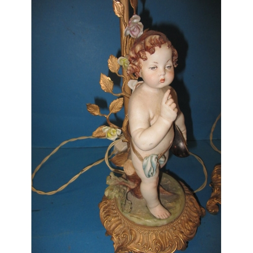 2 - Two vintage Italian porcelain cherub lamps, one with damage to fingers, the other loose to base, app... 