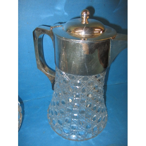 7 - A lead crystal claret jug and water jug, both with plated mounts and in good pre-owned condition, on... 