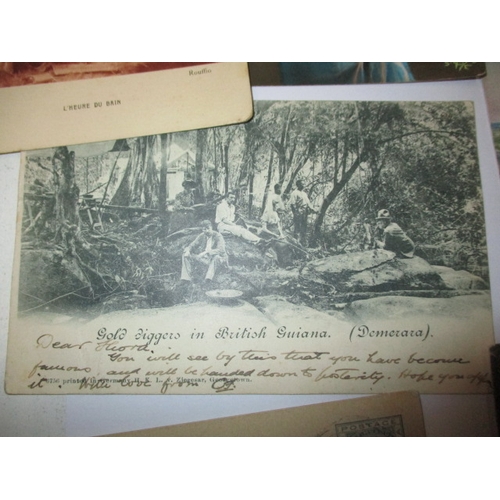 57 - A quantity of Victorian and later postcards, to include British Guiana gold mining and erotic exampl... 