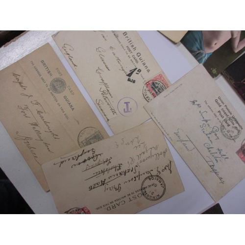 57 - A quantity of Victorian and later postcards, to include British Guiana gold mining and erotic exampl... 