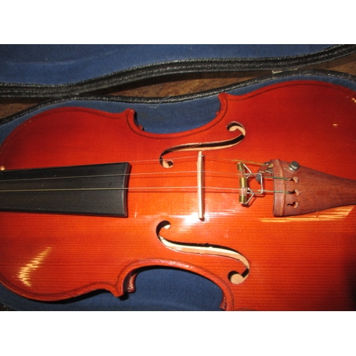 62 - A cased violin and bow, in good pre-owned condition