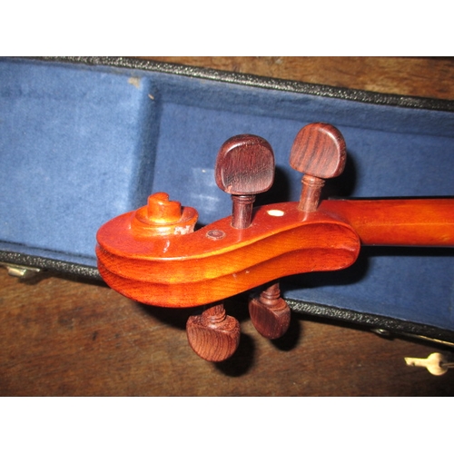 62 - A cased violin and bow, in good pre-owned condition