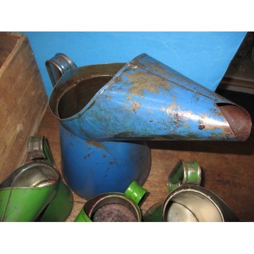 71 - A parcel of vintage automotive lubrication cans and a Morris chain hoist, all in used condition