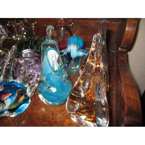 73 - A quantity of glass paperweights and ornaments, all in pre-owned condition so may have use related m... 