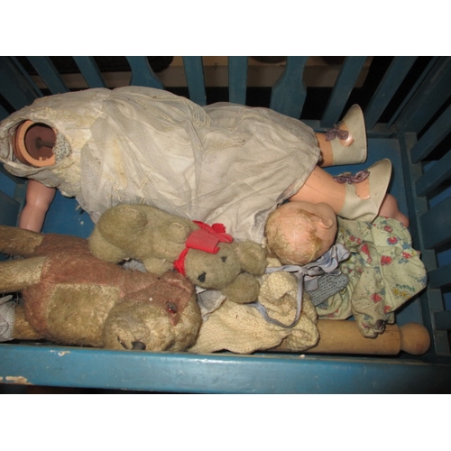 85 - A quantity of vintage dolls and a toy cot, all in well used condition some with damages