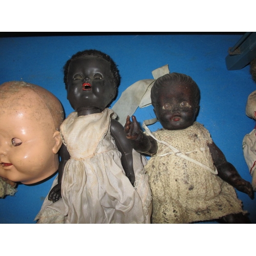 85 - A quantity of vintage dolls and a toy cot, all in well used condition some with damages