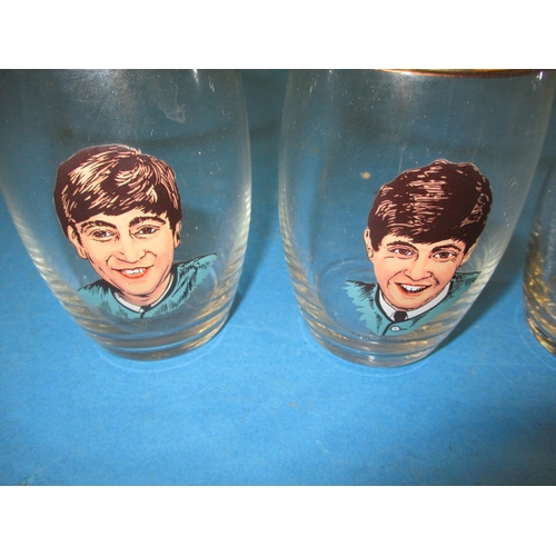 88 - A set of 4 Beatles lemonade glass, 1960’s period items in good pre-owned condition