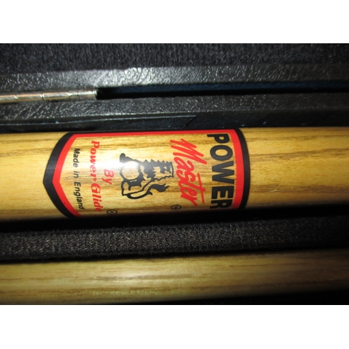 91 - A Power Master two piece snooker cue in a BCE hard case, in good pre-owned condition