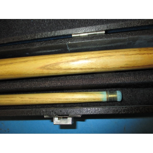 91 - A Power Master two piece snooker cue in a BCE hard case, in good pre-owned condition