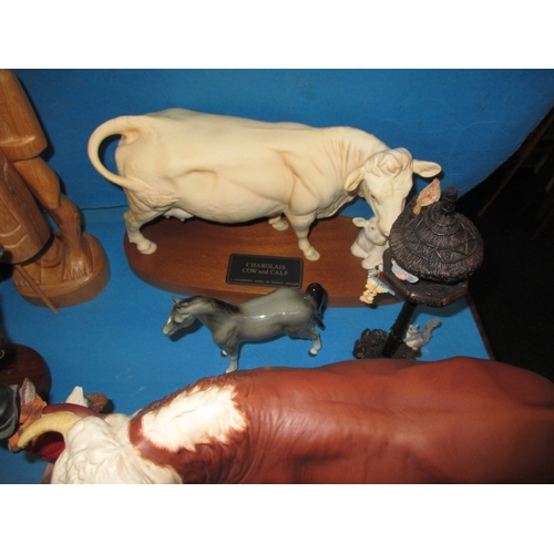 105 - A parcel of interesting collectables, to include large model cows and a Coalport art deco figurine, ... 