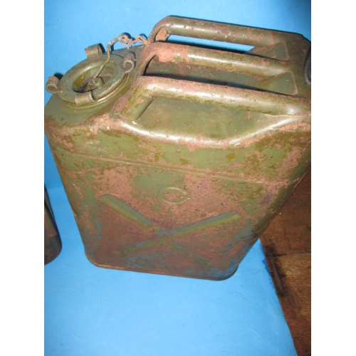 112 - An early 20th century Shell petrol can and two military ‘Jerry’ cans, all in used condition