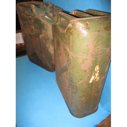 112 - An early 20th century Shell petrol can and two military ‘Jerry’ cans, all in used condition