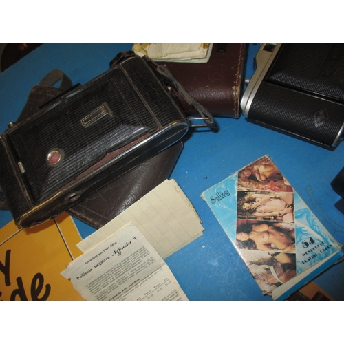 116 - A parcel of miscellanea, to include cameras, watches and a cheroot holder, all in used condition