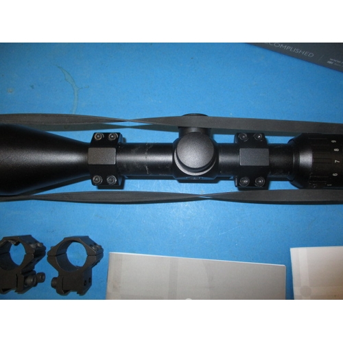 128 - A Hawk fast mount rifle scope 3-9x50, in box and a front mount bi-pod, both in used condition