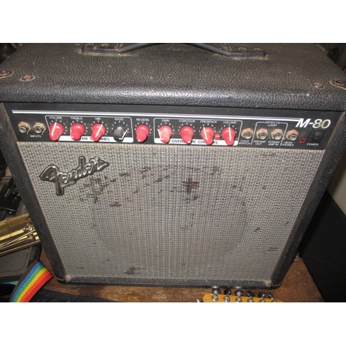 134 - An electric guitar, amp and numerous associated accessories, all in used condition and not tested as... 