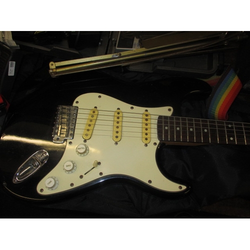 134 - An electric guitar, amp and numerous associated accessories, all in used condition and not tested as... 