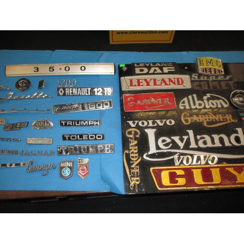 141 - A large collection of vintage vehicle model identification badges, to include numerous commercial ex... 