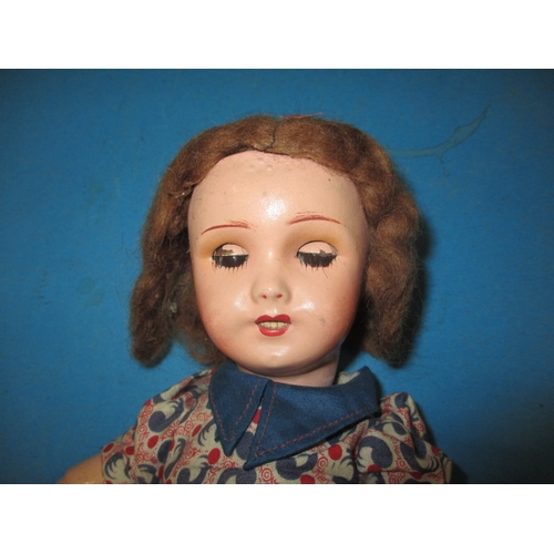 146 - A vintage French UNIS 301 bisque head doll with composite body, approx. height 35cm in good pre-owne... 