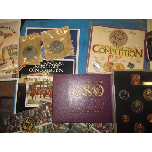 149 - A large quantity of collectors coins, to include Royal Mint year sets and silver proof examples