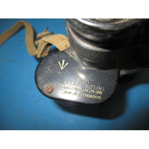 156 - A pair of WWII Taylor & Hobson binoculars with crows foot mark and dated 1943, in used condition