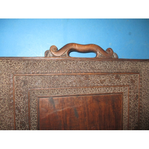 158 - A vintage Indian carved wood fold up tray table, useable but would benefit from some restoration, ap... 