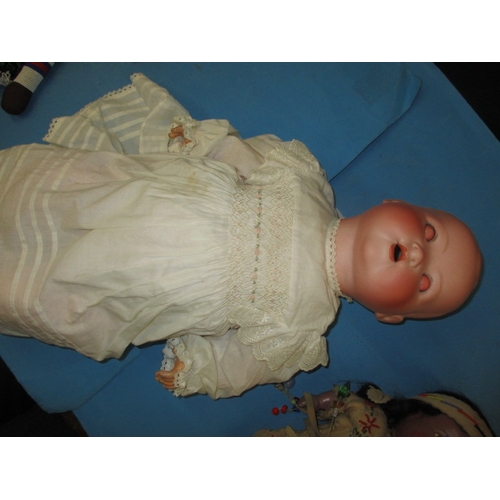 161 - A parcel of vintage dolls, to include a large German bisque head model, all in used condition