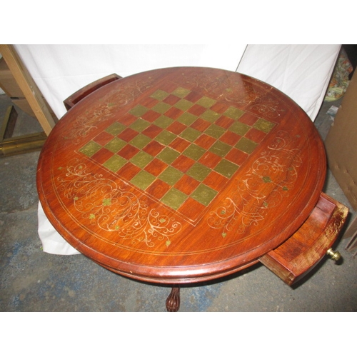 162 - A vintage circular games table with inlaid brass chess board top, approx. diameter 71cm, approx. hei... 