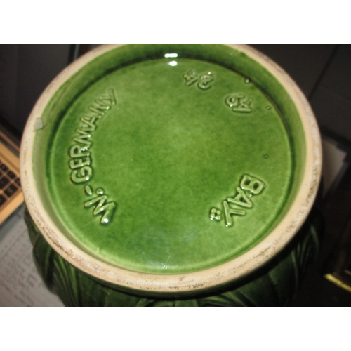 168 - A large green glazed garden plant pot 62cm high and a West German jardinière on stand, both in useab... 