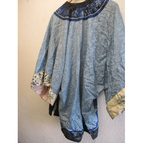 183 - A vintage Oriental silk jacket, in well used condition which would benefit from renovation