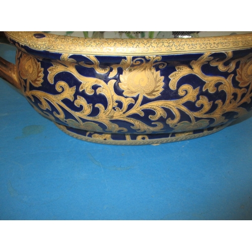 190 - A vintage ceramic oriental style fish bowl, with decorative interior and gilt blue outside decoratio... 