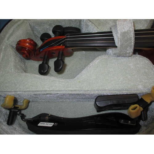 193 - A student violin in travel case with bow and music stand, in useable pre-owned condition