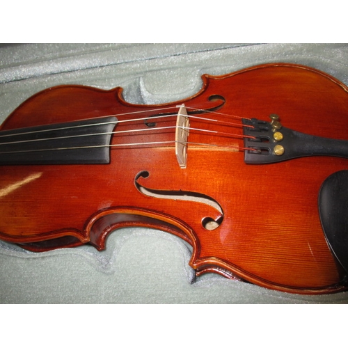 193 - A student violin in travel case with bow and music stand, in useable pre-owned condition