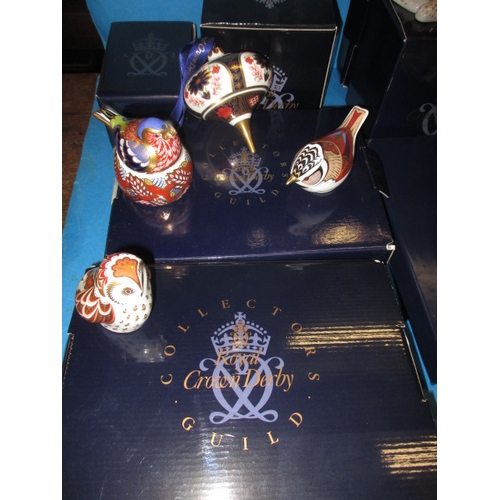 200 - A quantity of Royal Crown Derby Porcelain, to include paperweights with gold stoppers. One small rab... 