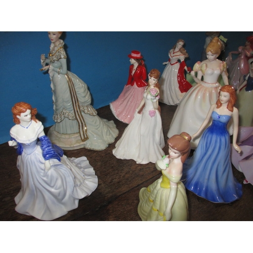 210 - A quantity of ceramic figurines to include examples by Doulton and Wedgwood. No observed damage