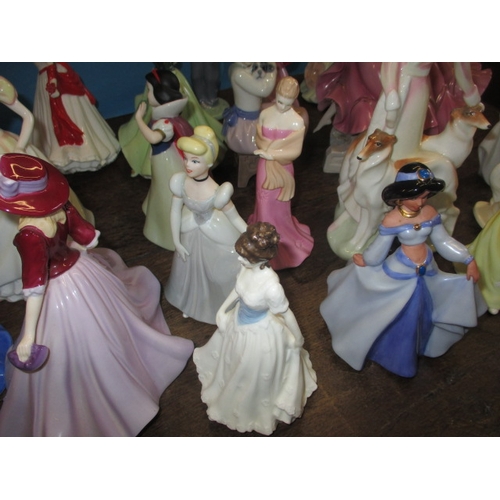 210 - A quantity of ceramic figurines to include examples by Doulton and Wedgwood. No observed damage