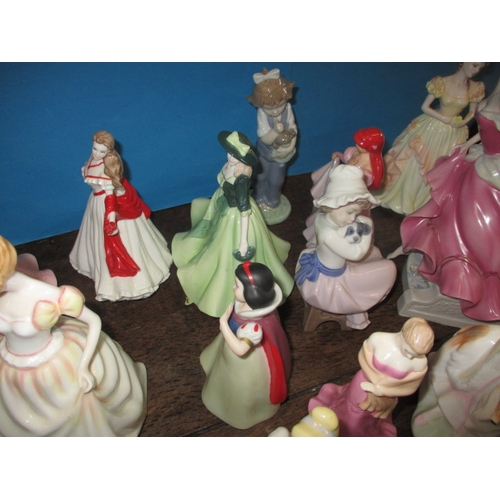 210 - A quantity of ceramic figurines to include examples by Doulton and Wedgwood. No observed damage