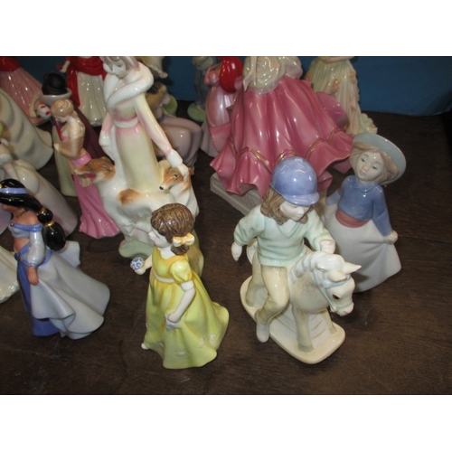 210 - A quantity of ceramic figurines to include examples by Doulton and Wedgwood. No observed damage