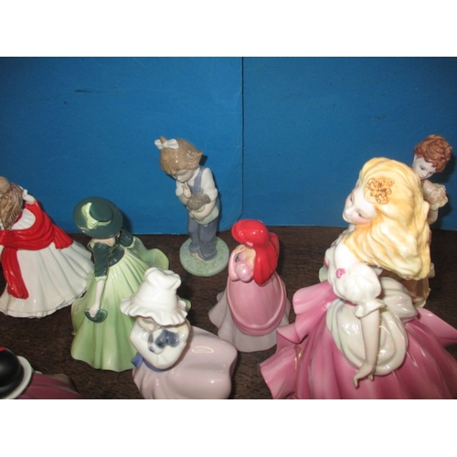 210 - A quantity of ceramic figurines to include examples by Doulton and Wedgwood. No observed damage