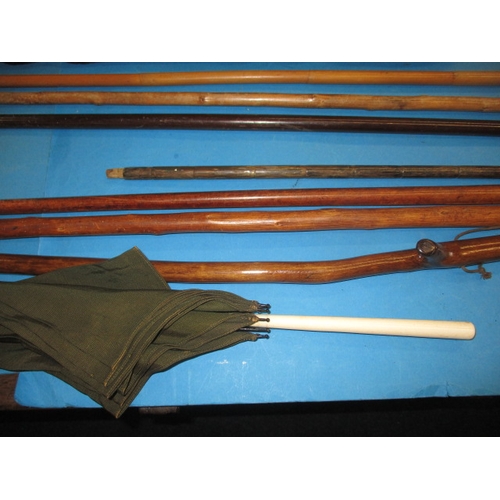 212 - A parcel of vintage walking sticks and a parasol, some with silver mounts, all in used condition