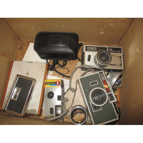 214 - An assortment of vintage cameras and binoculars, all in used condition and not tested as to function