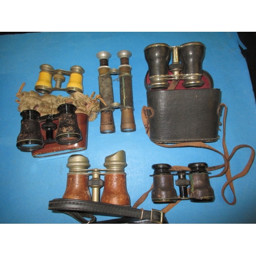 214 - An assortment of vintage cameras and binoculars, all in used condition and not tested as to function