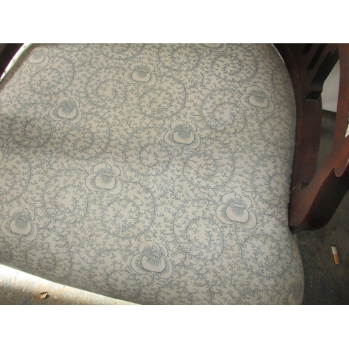 216 - An antique show wood, upholstered horse shoe parlour chair. Age related marks, in pre-owned conditio... 