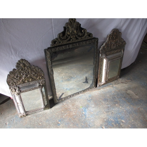 219 - 3 vintage Asian brass wall mirrors. Approximate size of largest 74cm x 48cm, some age related marks