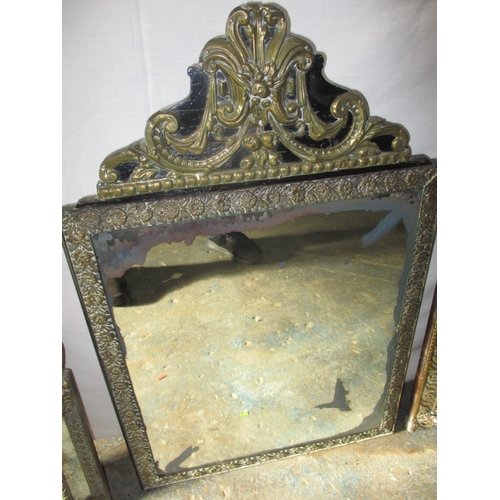 219 - 3 vintage Asian brass wall mirrors. Approximate size of largest 74cm x 48cm, some age related marks