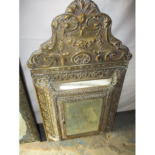 219 - 3 vintage Asian brass wall mirrors. Approximate size of largest 74cm x 48cm, some age related marks