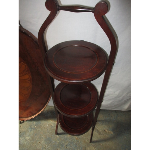 221 - A vintage shell inlaid butlers tray and a folding cake stand. Approximate length of tray 71cm