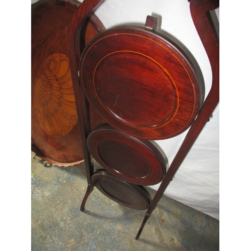 221 - A vintage shell inlaid butlers tray and a folding cake stand. Approximate length of tray 71cm