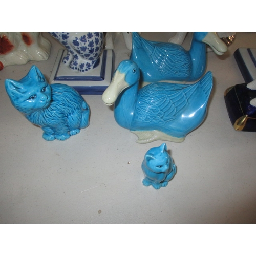 222 - A quantity of ceramic figures, to include Staffordshire mantle dogs and cats. All in pre-owned condi... 